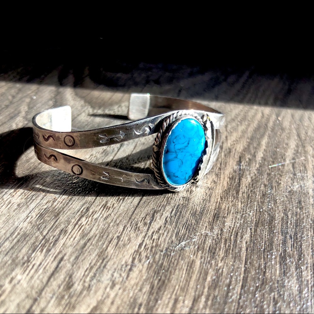 Silver faux stone cuff.